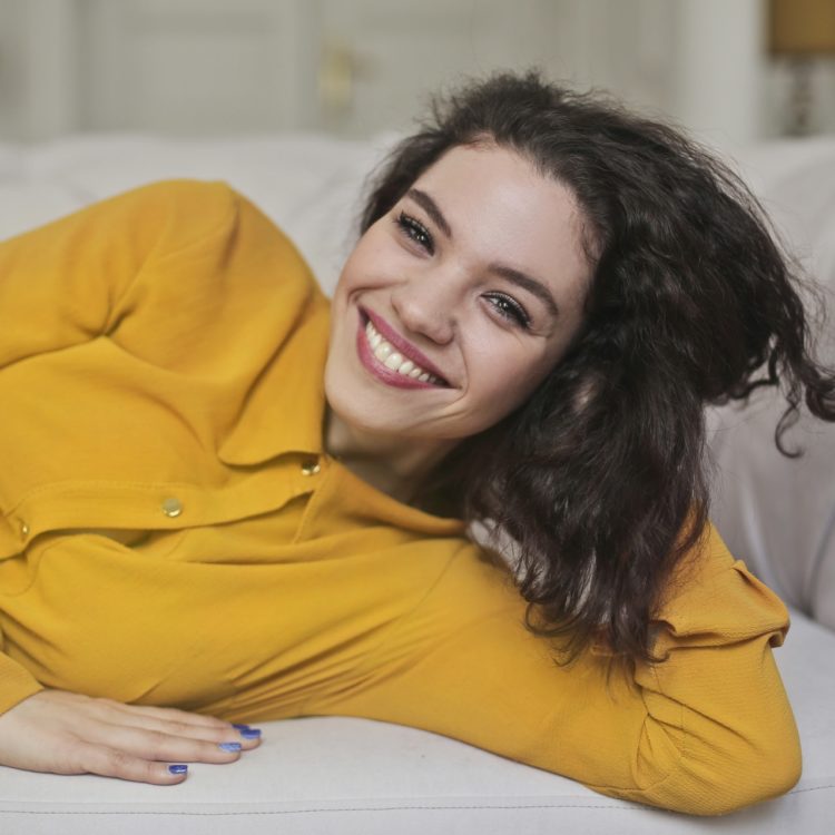 Smiling woman who uses invisalign