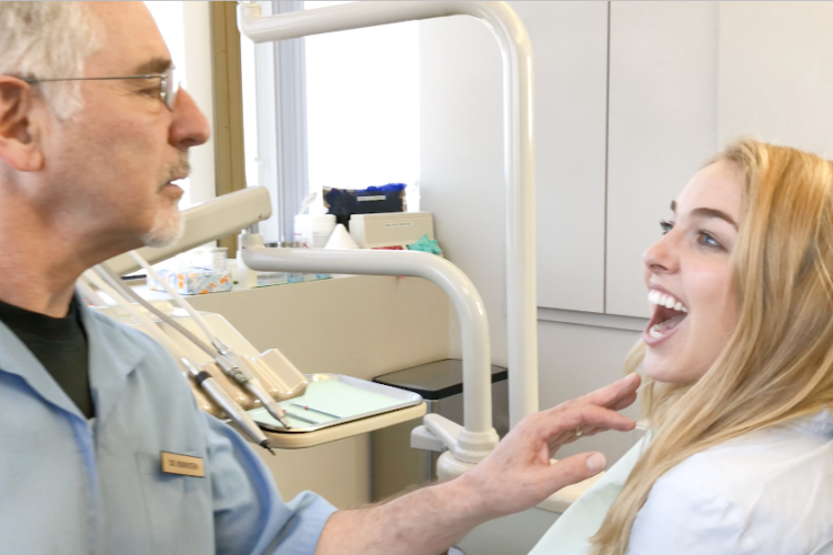 Dentist checking patient's smile